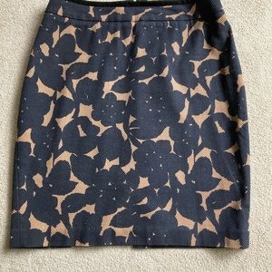 100% cotton lined skirt black(could be navy) and tan floral pattern.